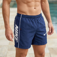 شورت سباحة سادة للرجال فوق الركبة للرجال 2جيب يغلق بسوستة على كل جانب وجيب خلفي